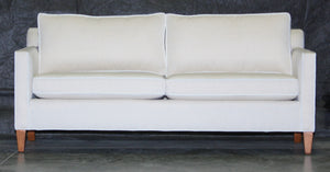 A Douglas condo sofa in white